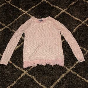 A pale pink lace detail sweater